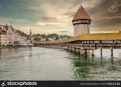 Historic city center of Lucerne with Chapel Bridge and lake Lucerne under dramatic sky, Canton of Lucerne, Switzerland