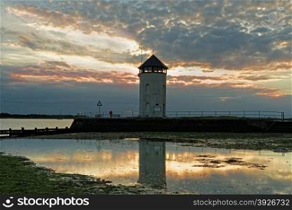 Historic coastal lookout tower on the coast in the UK. Seen at sunset.