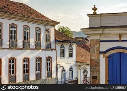 Historic colonial houses in the city of Ouro Preto with its typical facades of historic cities in the interior of the state of Minas Gerais, Brazil. Historic colonial houses in the city of Ouro Preto with its typical facades