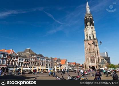 Historic Delft Market Square with the Nieuwe Kerk (new Church) and the City Hall