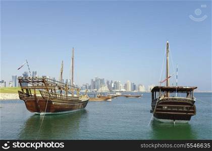 Historic dhows moored off Museum Park in Doha, Qatar, November 2013, with the 21st Century city skyline beyond