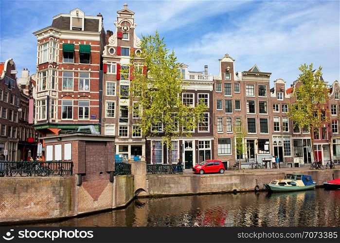 Historic Dutch houses in Amsterdam by the Geldersekade canal, Netherlands, North Holland province.