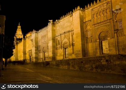 Historic facade of the Mezquita at night in Cordoba, Andalusia, Spain