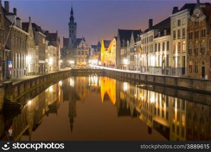 Historic medieval buildings in Bruges, Belgium at night.
