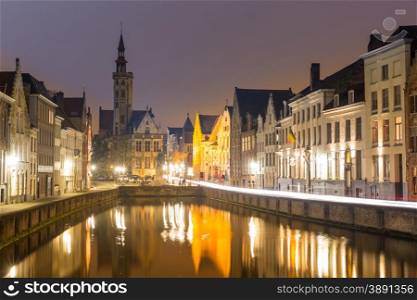 Historic medieval buildings in Bruges, Belgium at night.