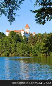 Historic medieval Konopiste Castle in Czech Republic ( central Bohemia, near Prague ) and summer pond near