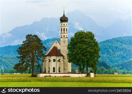 Historic medieval Neuschwanstein Castle in Bavaria (Germany) and church near