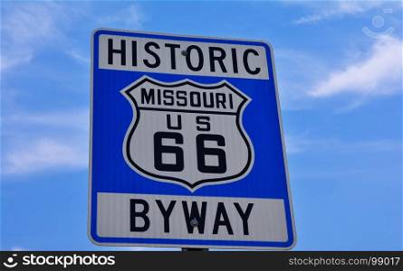 Historic route 66 highway sign in Missouri USA. Blue sky background
