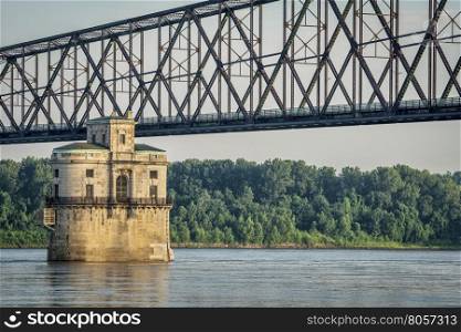 Historic water intake tower number 2 built in 1915 and the Old Chain of Rocks bridge on the Mississippi River above St Louis