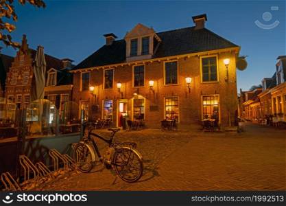 Historical buildings in the city Sloten in the Netherlands at night