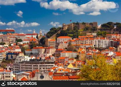 Historical centre of Lisbon on sunny day, Portugal. Aerial view of Castle of Saint George or Sao Jorge and the historical centre of Lisbon on the sunny afternoon, Lisbon, Portugal