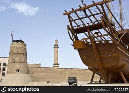 Historical Dubai Museum in Dubai with the minaret of the Grand Mosque in the background, United Arab Emirates