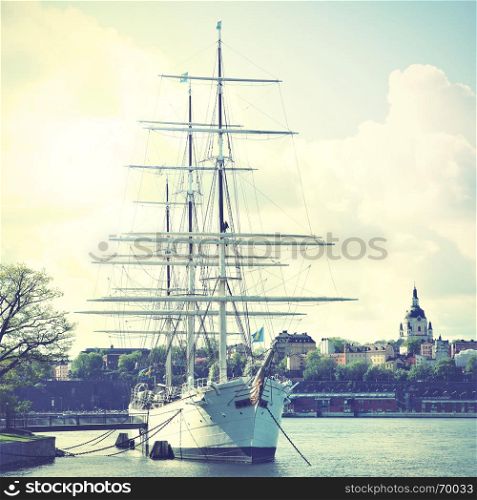 Historical ship at the Old Town in Stockholm, Sweden. Retro style filtred image