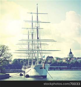 Historical ship at the Old Town in Stockholm, Sweden. Retro style filtred image