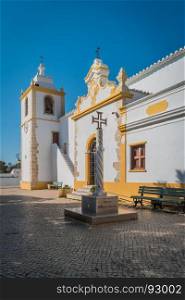 Historically church door of the Alvor Mother Church dedicated to divine Savior, Alvor, Portugal.