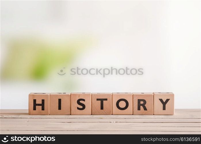 History lesson sign made of wood on a classroom table