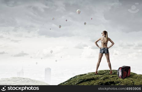 Hitch hiker woman on top. Young attractive girl in bikini and shorts on top