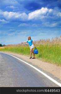 Hitchhiking girl votes on road