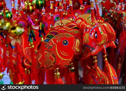 HO CHI MINH CITY, VIET NAM- JAN 25, 2019: Close up of vibrant red ornaments for Tet at decoration shop on China town, Cho Lon, a market place to decor for Lunar New Year, Vietnam