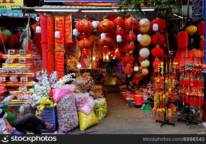 HO CHI MINH CITY, VIET NAM- JAN 25, 2019: Vibrant red ornaments for Asian Tet occasion show on facade of decoration shop on China town, Cho Lon, a market place to decor for Lunar New Year, Vietnam