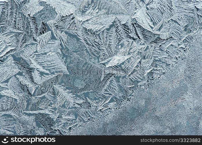 Hoarfrost on glass, texture of ice in thee cold winter.