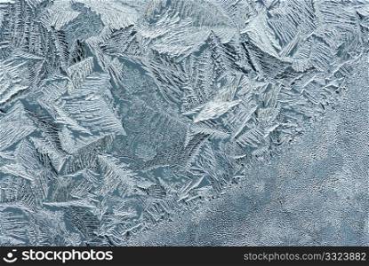 Hoarfrost on glass, texture of ice in thee cold winter.