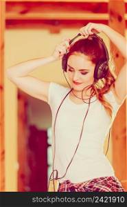 Hobby music expression and free time. Young girl listen music dance with hands on headphones.. Woman with headphones listen music and dance.