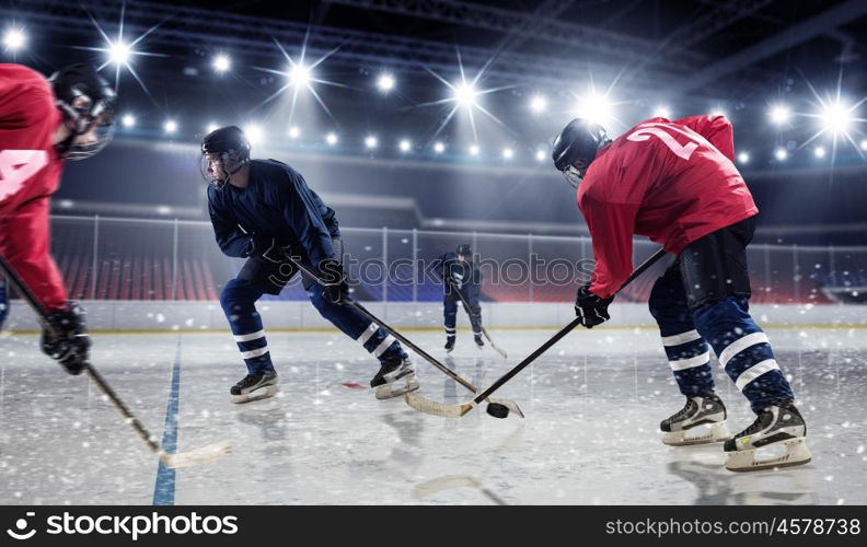 Hockey match at rink mixed media. Hockey players shoot the puck and attacks