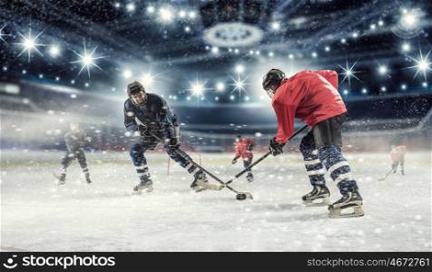 Hockey match at rink mixed media. Hockey players shoot the puck and attacks