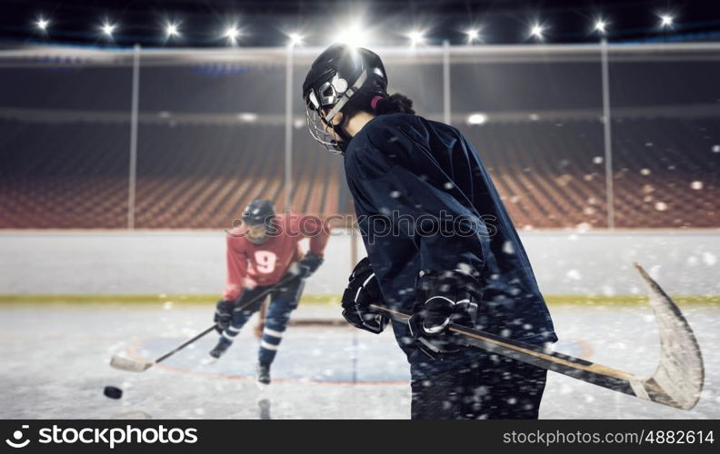 Hockey match at rink mixed media. Hockey players shoot the puck and attacks