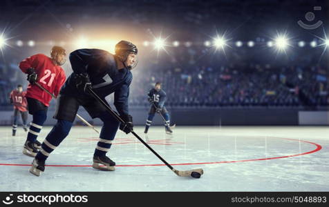 Hockey match at rink mixed media. Hockey players shoot the puck and attacks