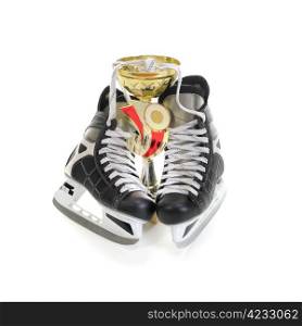 Hockey skates and cup winner. Isolated on white background