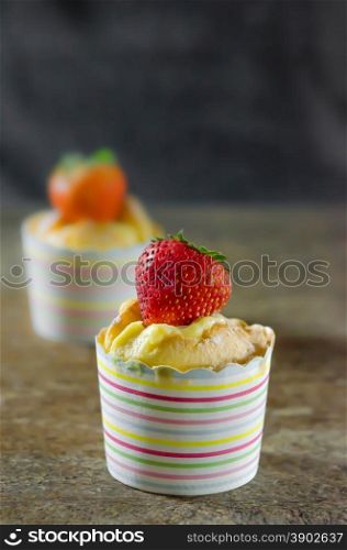 Hokkaido Chiffon Cupcakes. Hokkaido Chiffon Cupcakes over wooden table
