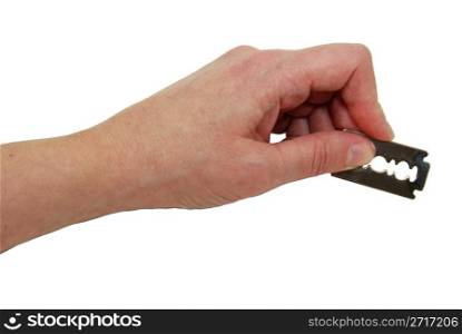 Holding a silver razor blade used for shaving or cutting items - path included