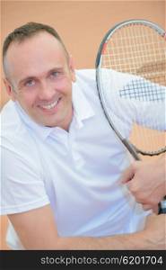 holding a tennis racket