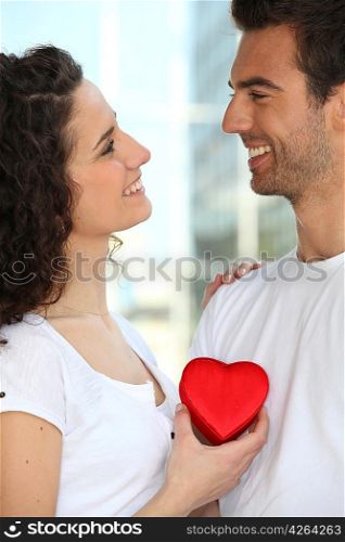 Holding heart-shaped box