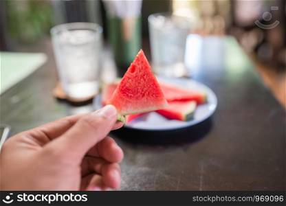 holding watermelon in healthy meal