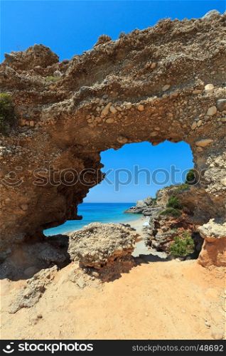 Hole in rock on Drymades beach, Albania. Summer Ionian sea coast view.