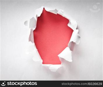 Hole in the paper with torn sides