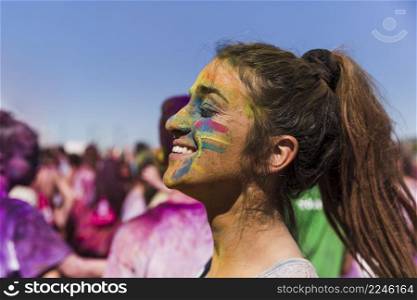 holi color woman s face front crowd