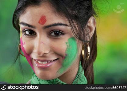 Holi colours on woman&rsquo;s face