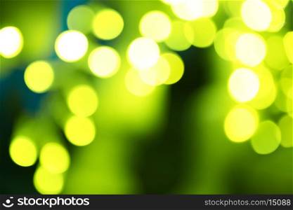 Holiday abstract green and yellow lights can be used for background