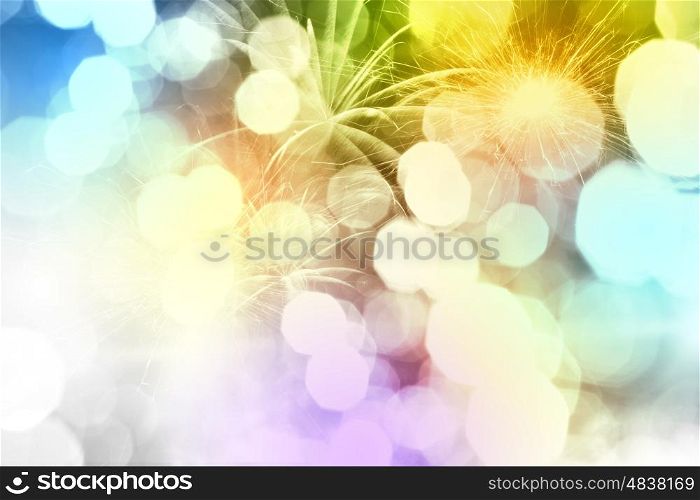 Holiday background. Conceptual image with bokeh lights and fireworks