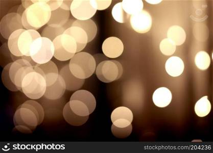 Holiday background. Festive abstract background with bokeh defocused lights. festive golden bokeh background