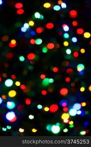 Holiday background from color unfocused lights