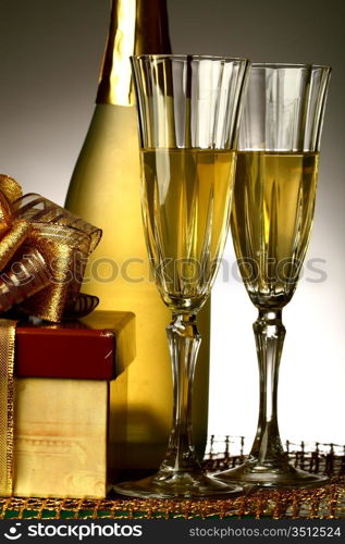 holiday card golden champagne and gift