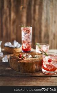 Holiday cold sparkling drink for party with ripe strawberry.