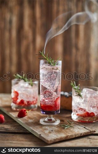 Holiday cold sparkling drink for party with ripe strawberry.  