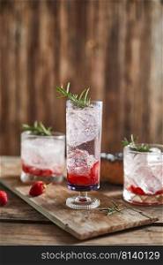 Holiday cold sparkling drink for party with ripe strawberry.  