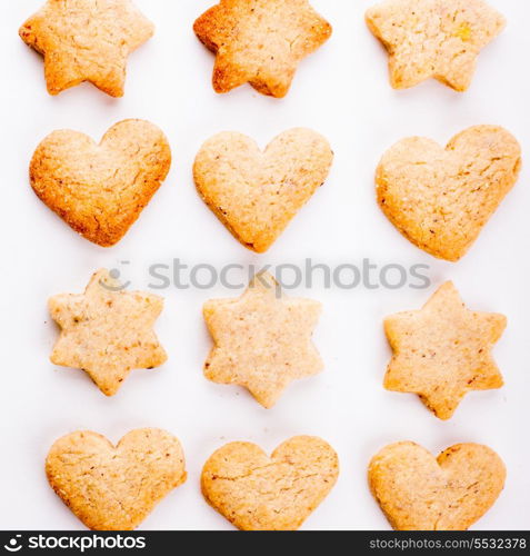 Holiday cookies as a background pattern on white